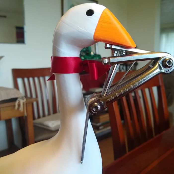 3d printed waterbird figurine with tool in beak