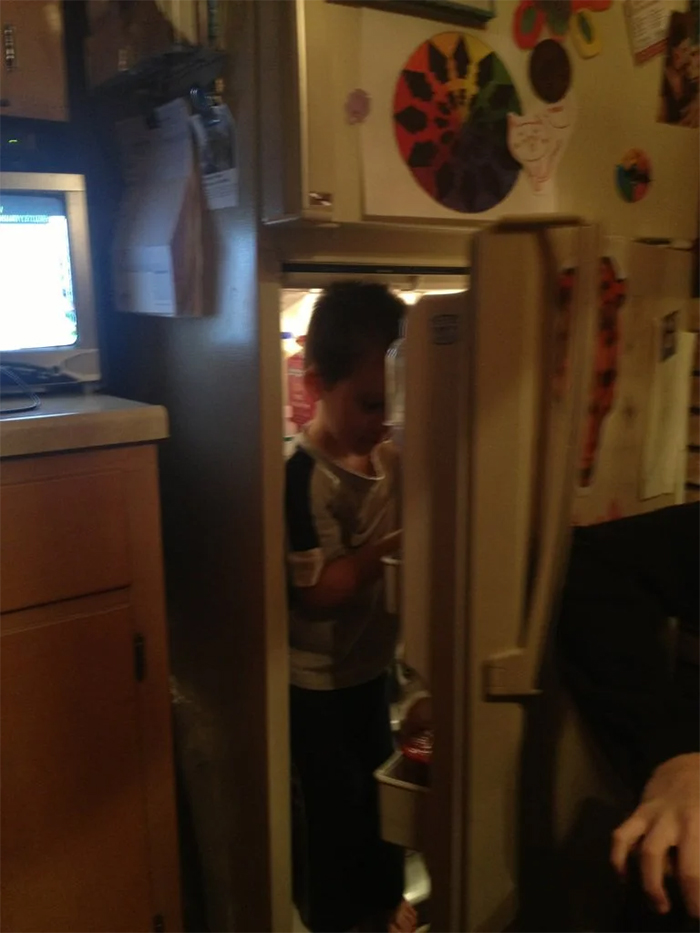 kid inside fridge hot day
