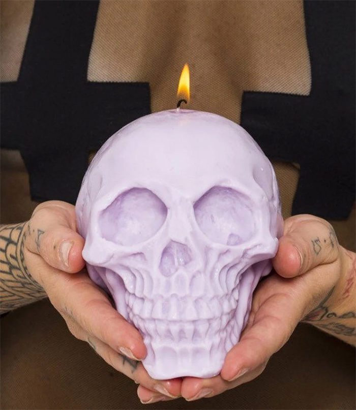 large skull candle pastel purple