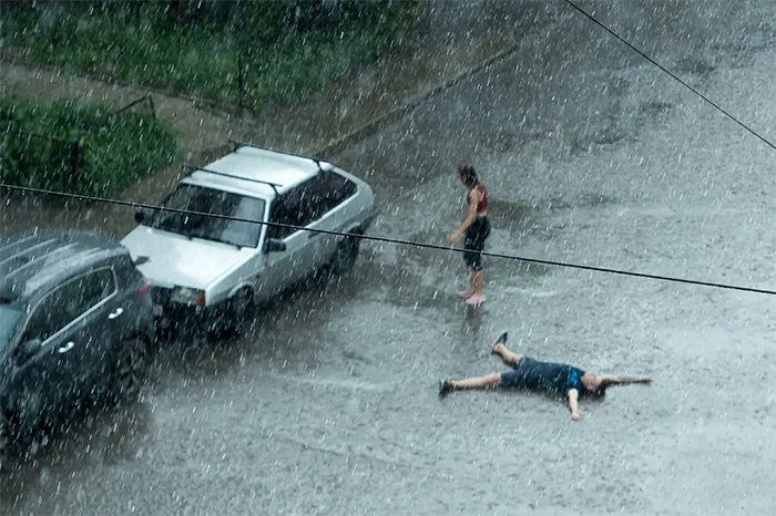 people enjoying the rain summer